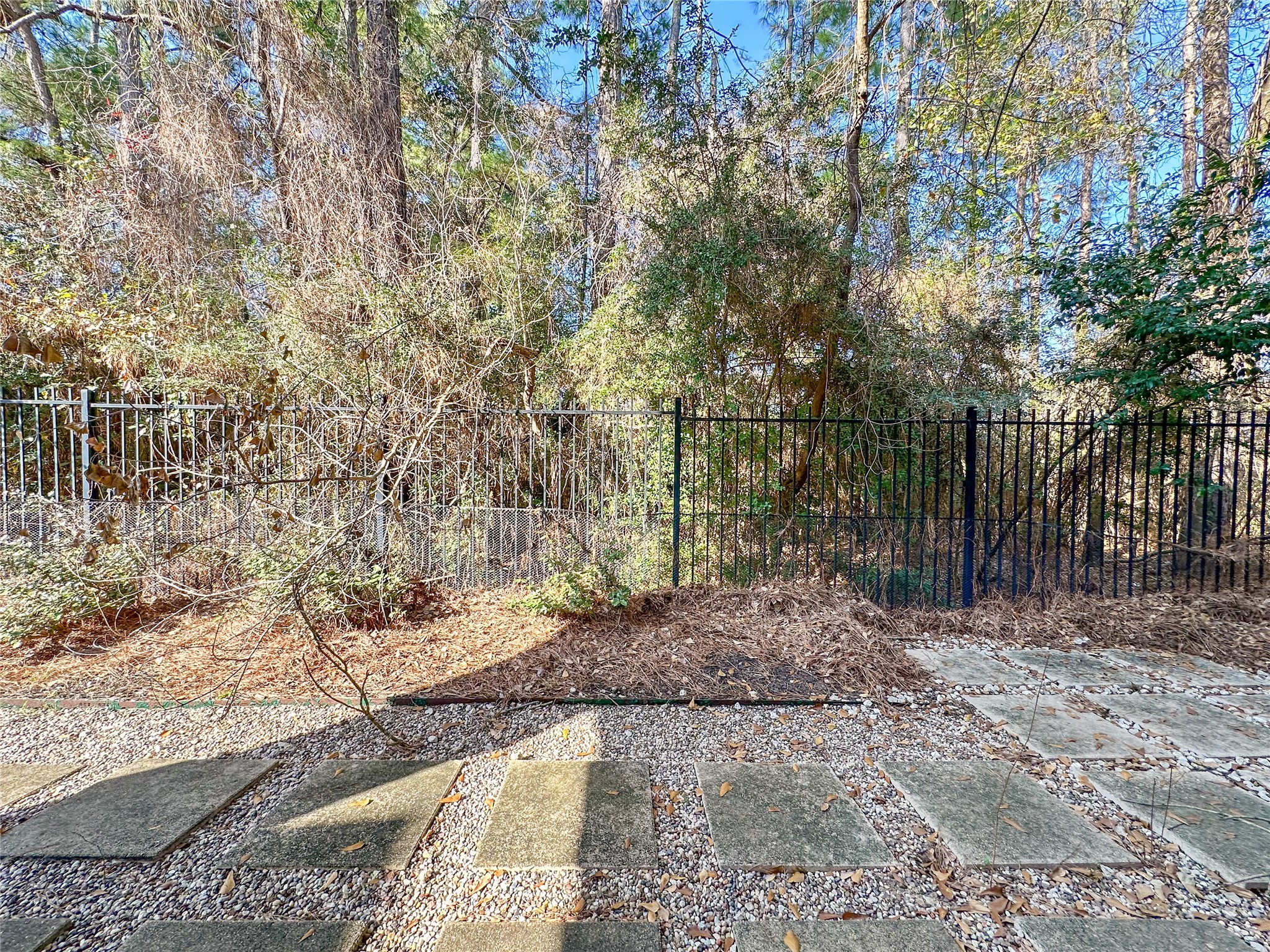 23 Jonquil Place Tomball, TX 77375 - Photo 50 of 50 a view of backyard with wooden fence