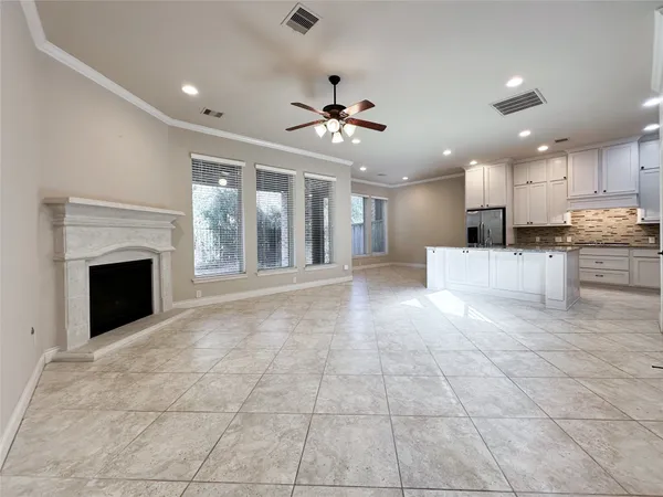 a view of a kitchen with an empty space and a fireplace