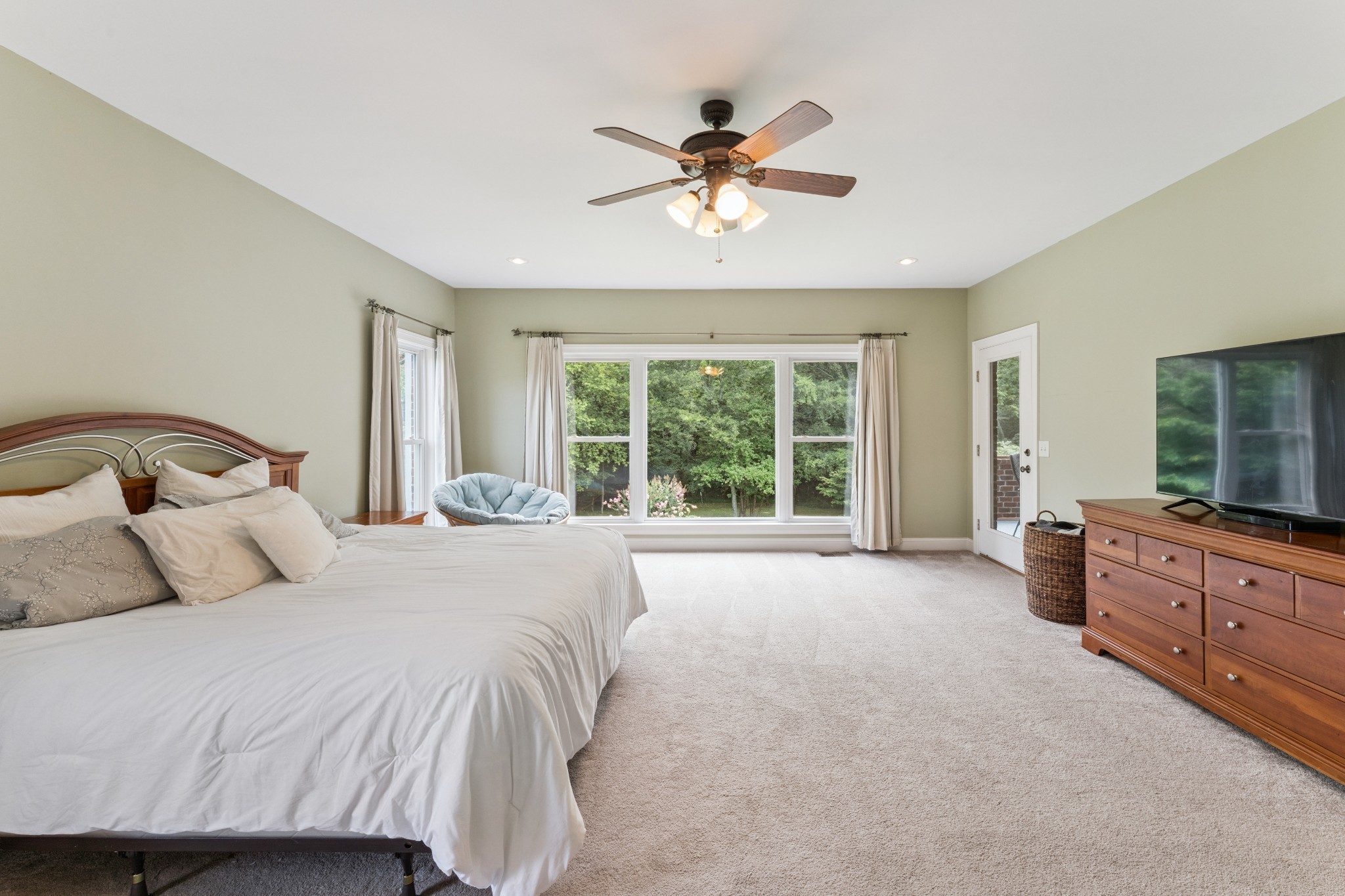 238 Ridgewater Way Mount Juliet, TN 37122 - Photo 19 of 67 a bedroom with a large bed and a chandelier fan