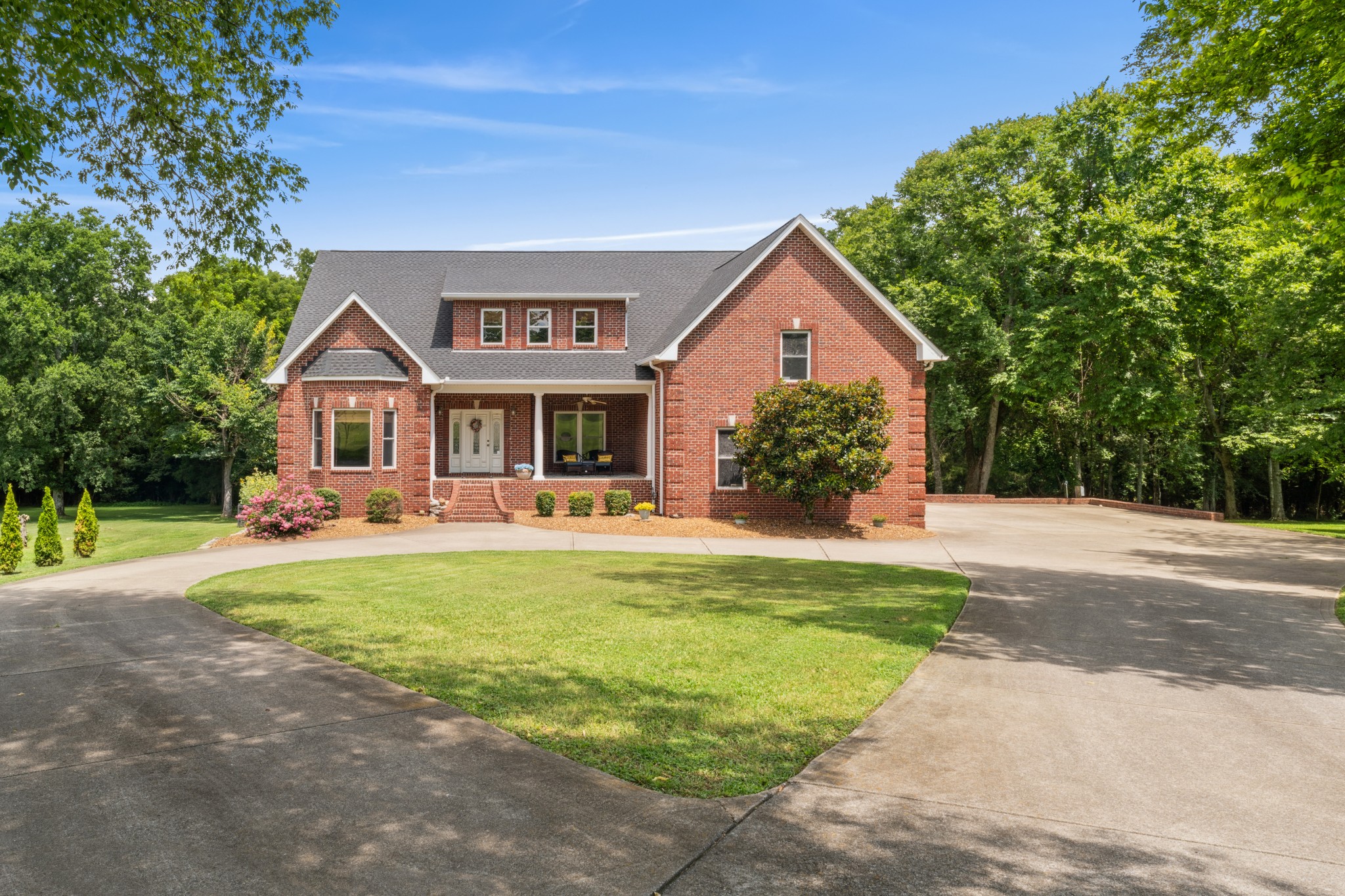 238 Ridgewater Way Mount Juliet, TN 37122 - Photo 2 of 67 a front view of a house with a yard and porch
