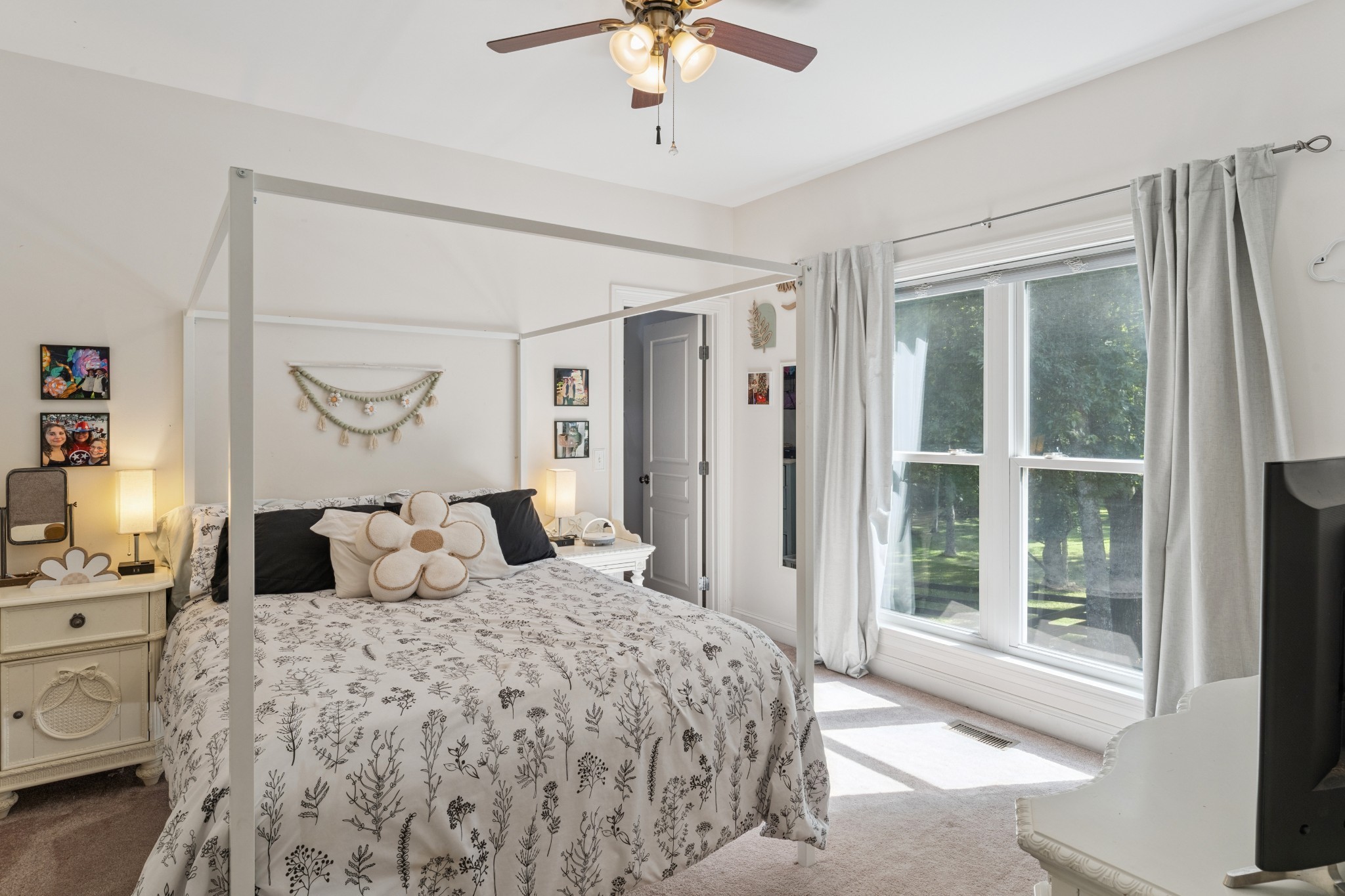 238 Ridgewater Way Mount Juliet, TN 37122 - Photo 22 of 67 a bedroom with a large bed and a chandelier fan