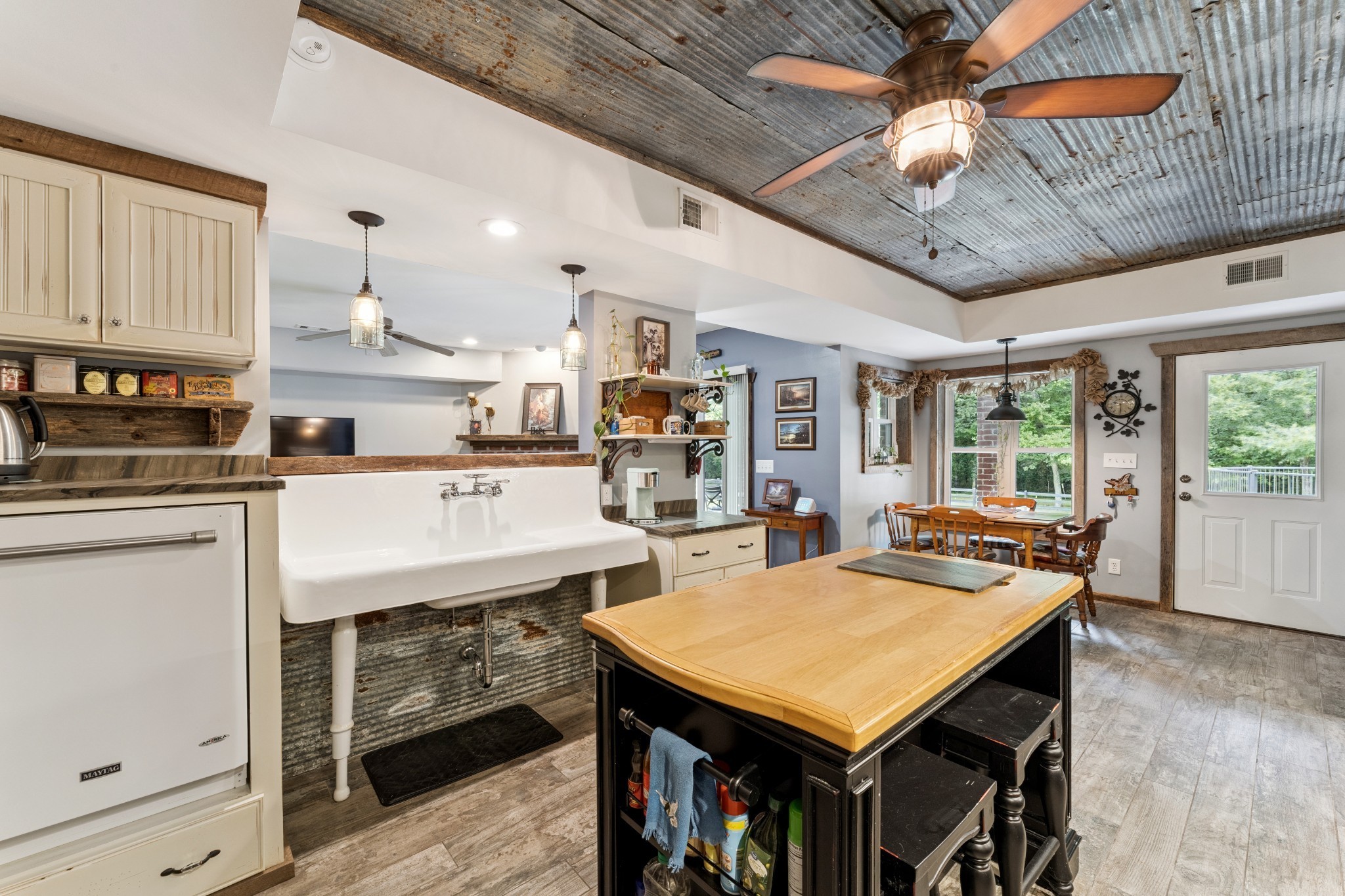 238 Ridgewater Way Mount Juliet, TN 37122 - Photo 37 of 67 a room with stainless steel appliances kitchen island granite countertop a table chairs and a refrigerator