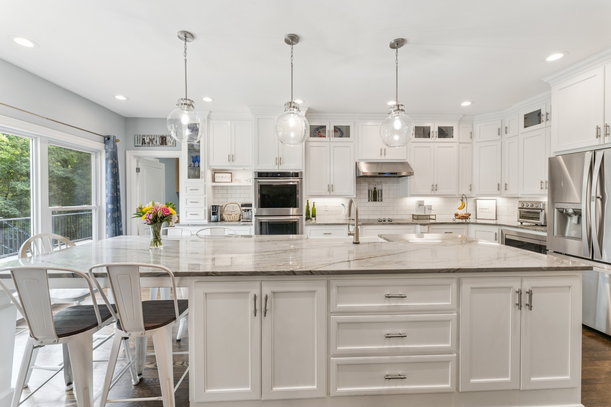 238 Ridgewater Way Mount Juliet, TN 37122 - Photo 7 of 67 a kitchen with stainless steel appliances kitchen island granite countertop a table and chairs in it