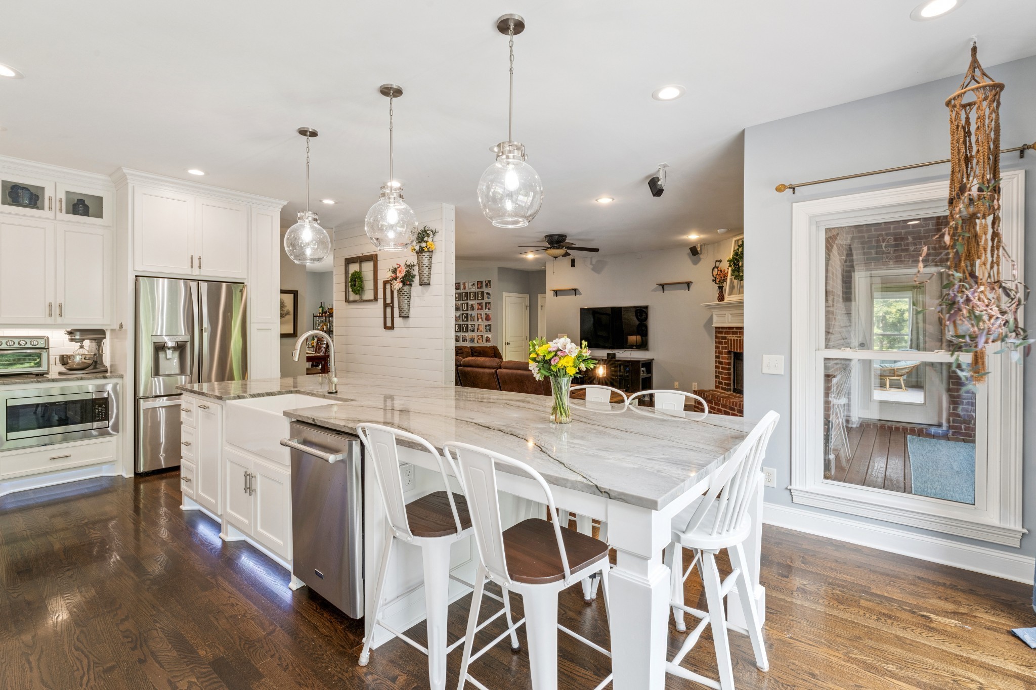 238 Ridgewater Way Mount Juliet, TN 37122 - Photo 8 of 67 a large kitchen with stainless steel appliances kitchen island granite countertop a table chairs and a chandelier