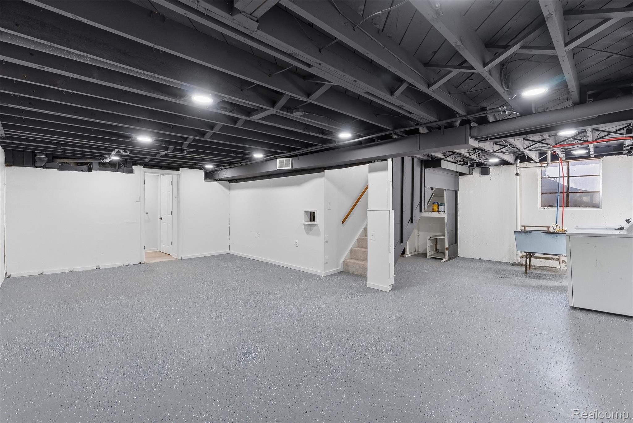 9101 Merriman Road Livonia, MI 48150 - Photo 31 of 41 Expansive unfinished basement featuring painted concrete flooring, recessed lighting, and exposed ceiling joists