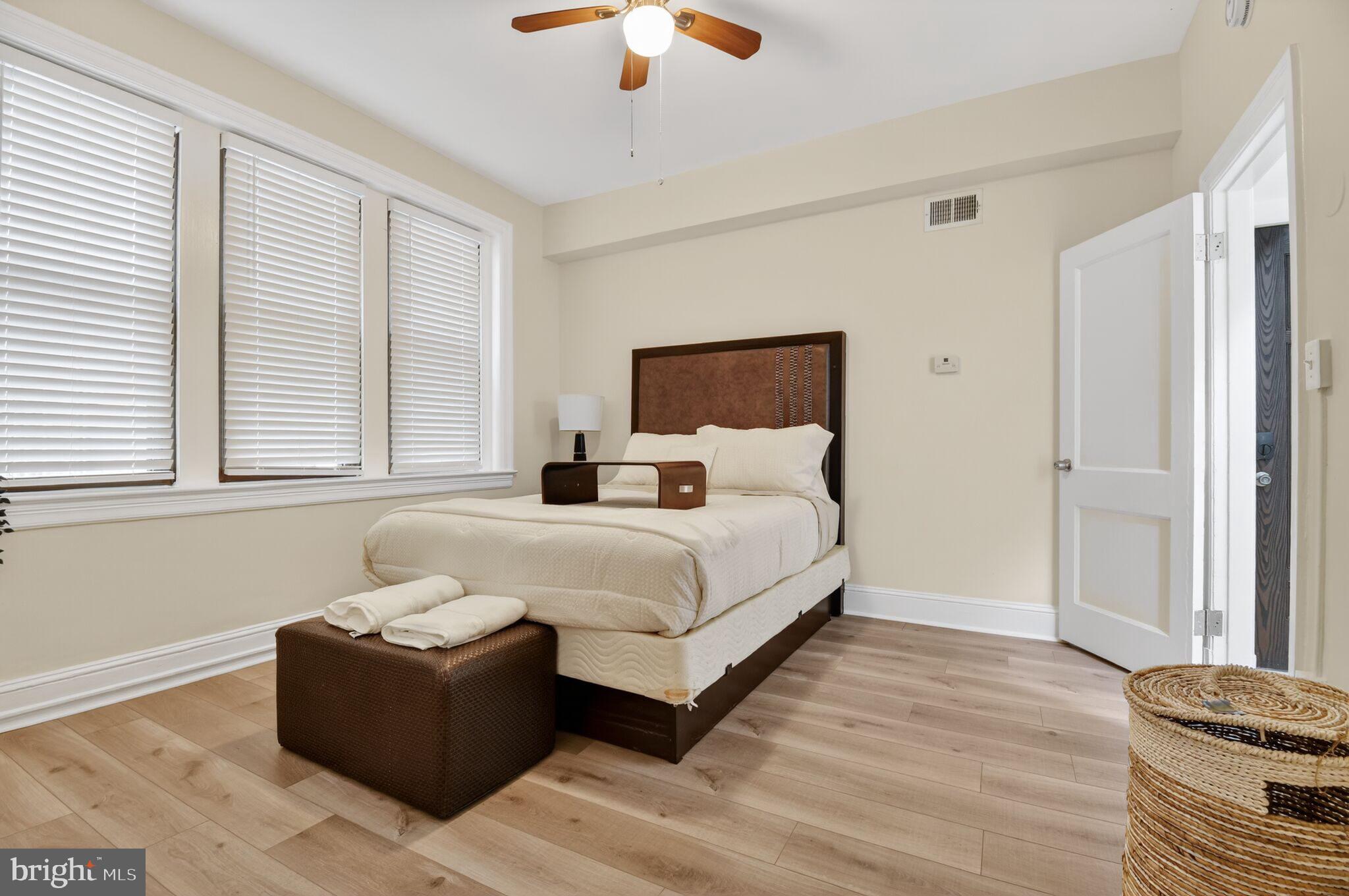 1919 19th Street Northwest, Unit 302 Washington, DC 20009 - Photo 13 of 16 a bedroom with a bed couch and window