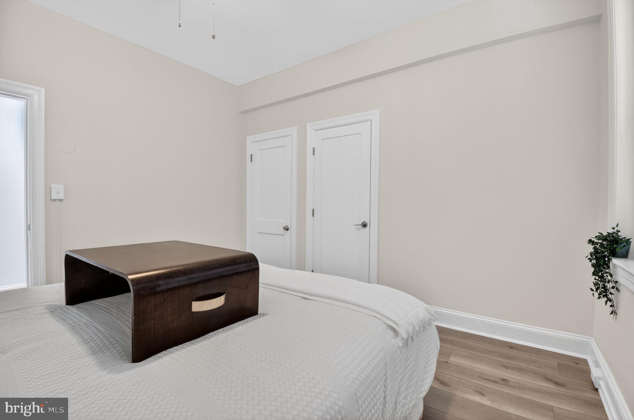 1919 19th Street Northwest, Unit 302 Washington, DC 20009 - Photo 14 of 16 a room with a bed