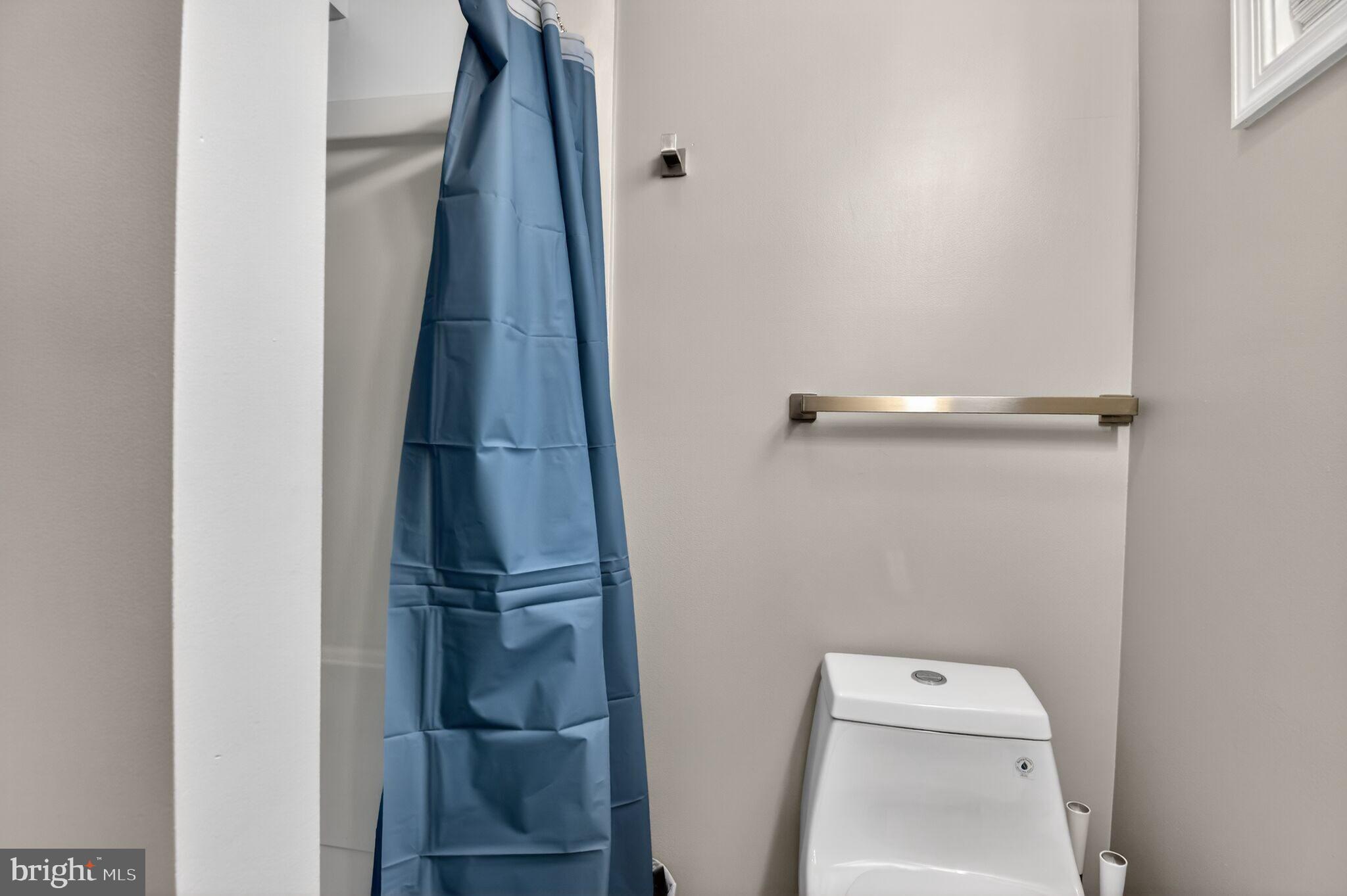 1919 19th Street Northwest, Unit 302 Washington, DC 20009 - Photo 8 of 16 a view of bathroom with a washer and dryer