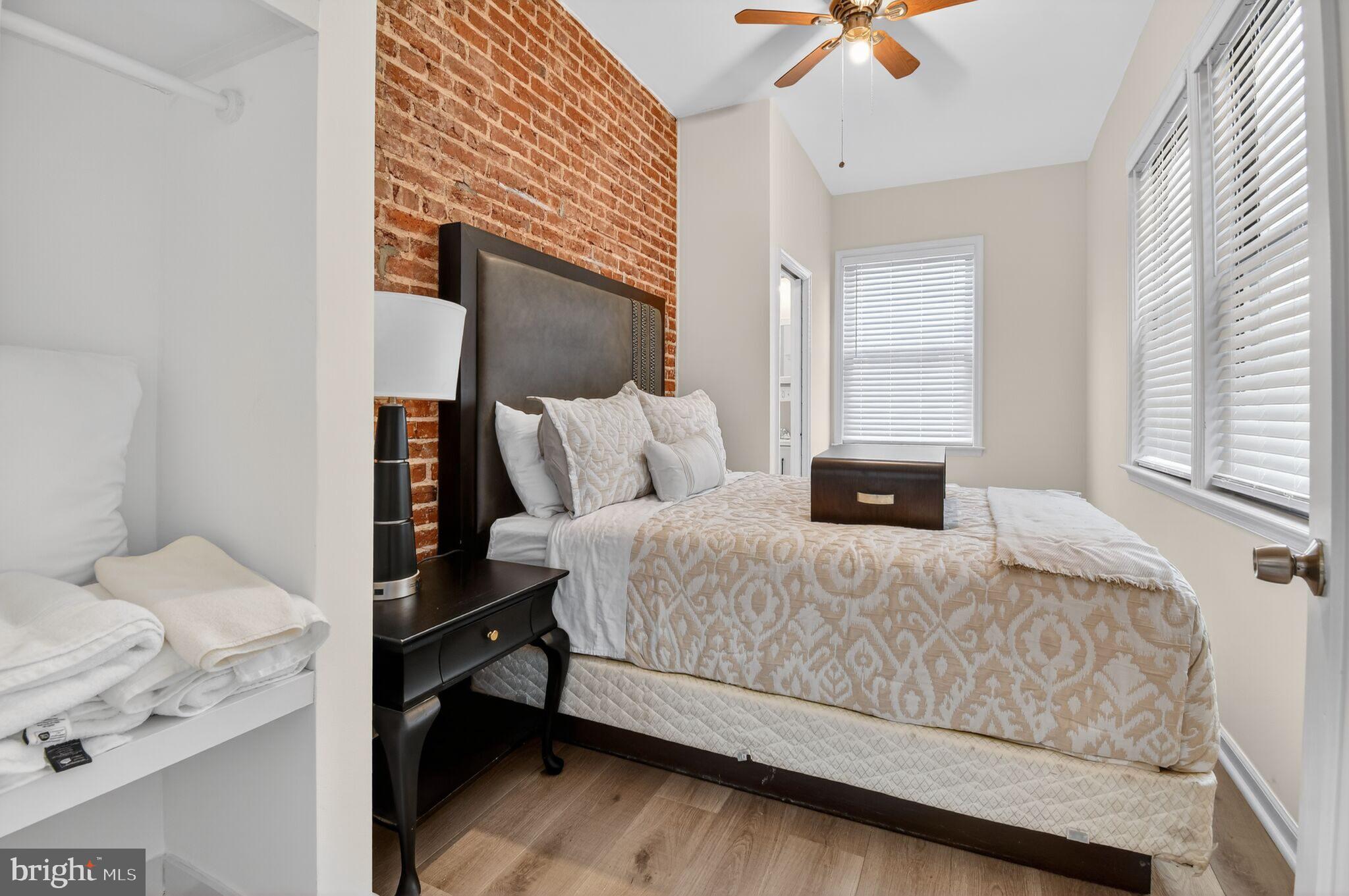 1919 19th Street Northwest, Unit 302 Washington, DC 20009 - Photo 10 of 16 a bedroom with a bed and window