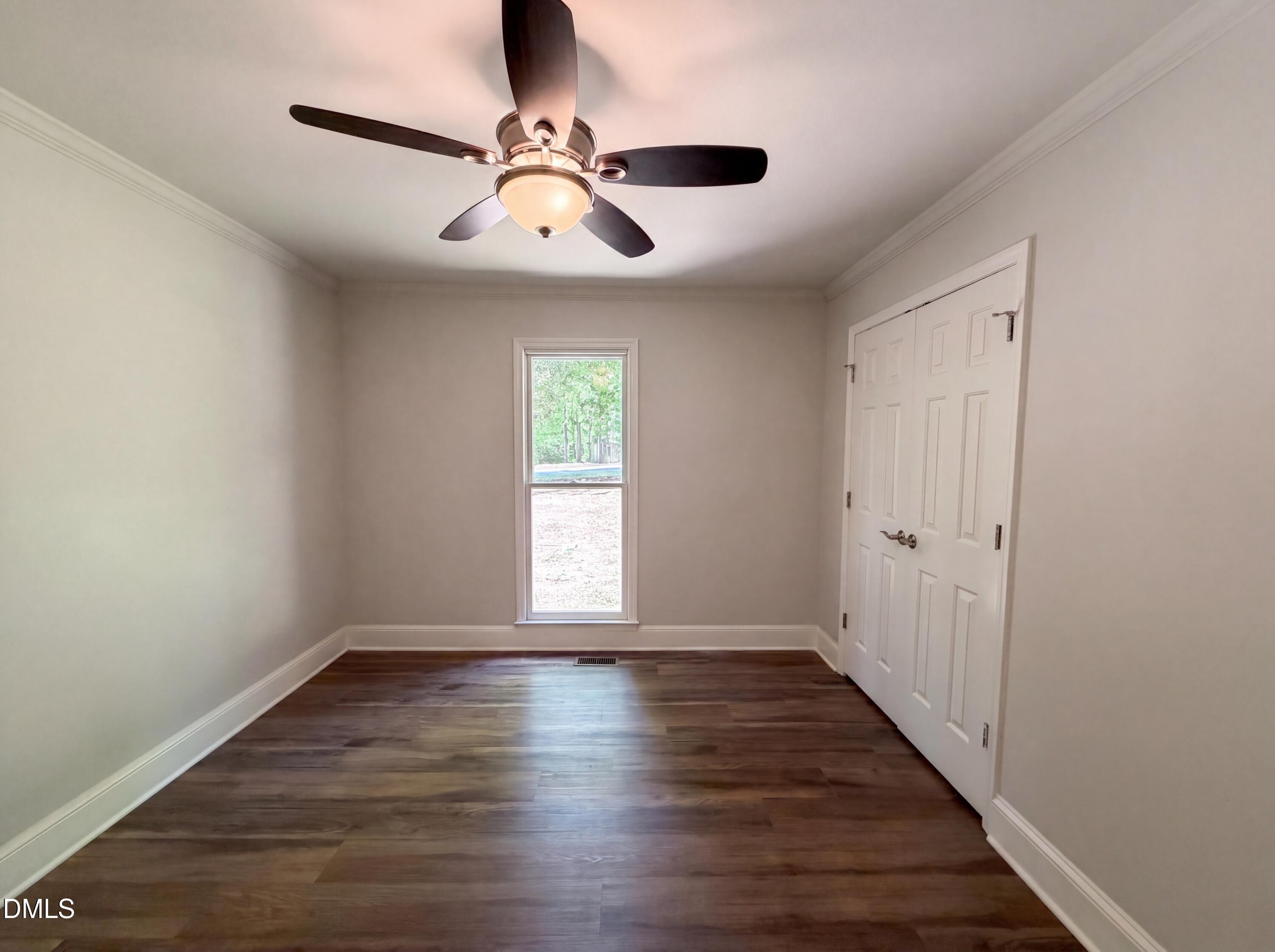 102 Lakeside Farm Road Zebulon, NC 27597 - Photo 13 of 18 wooden floor in an empty room with a window