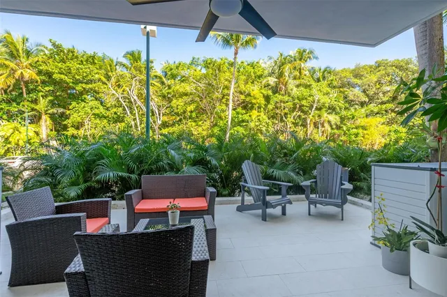 a patio with table and chairs