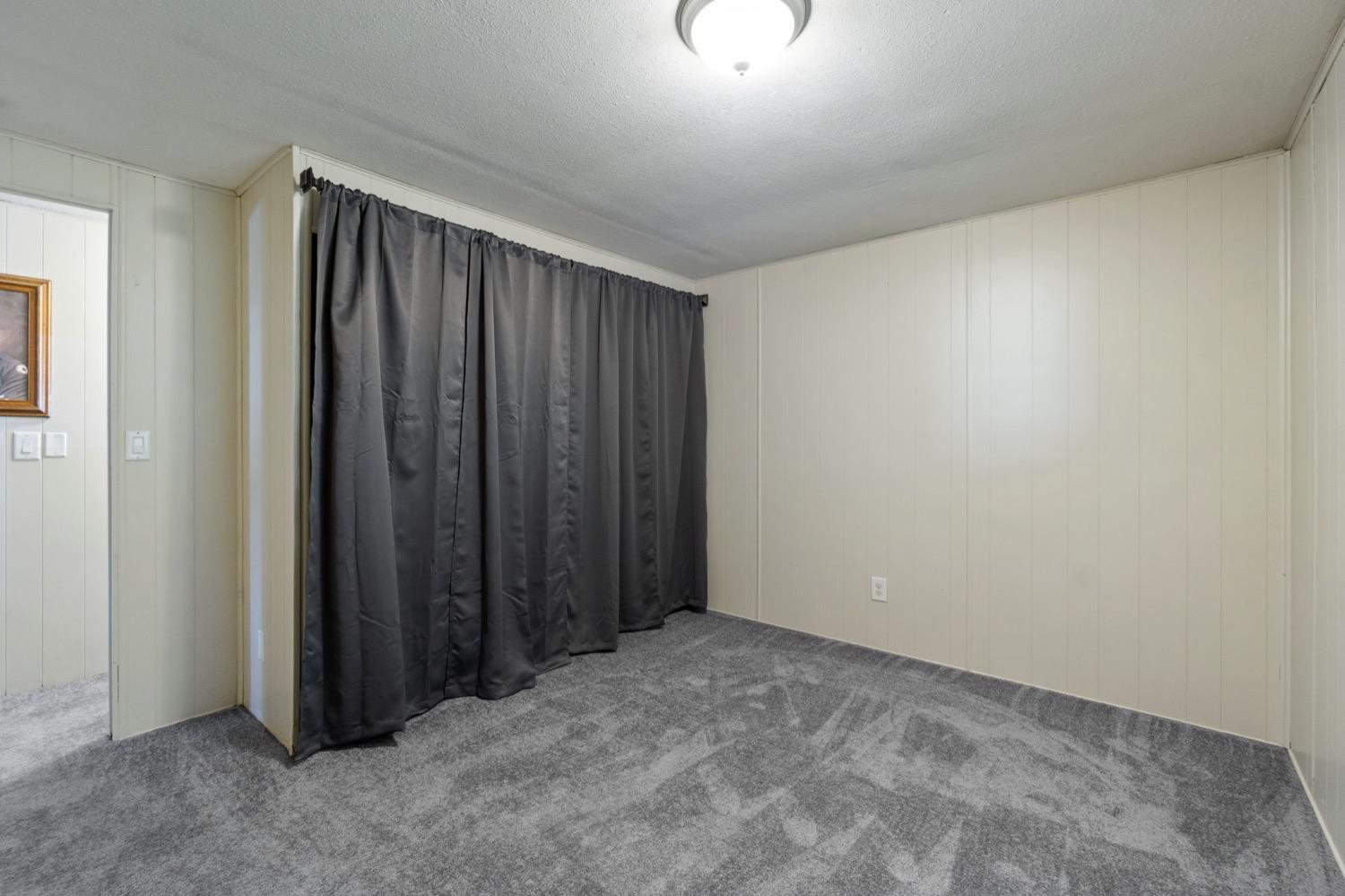 1500 Villa Avenue Clovis, CA 93612 - Photo 16 of 28 an empty room with a wooden door