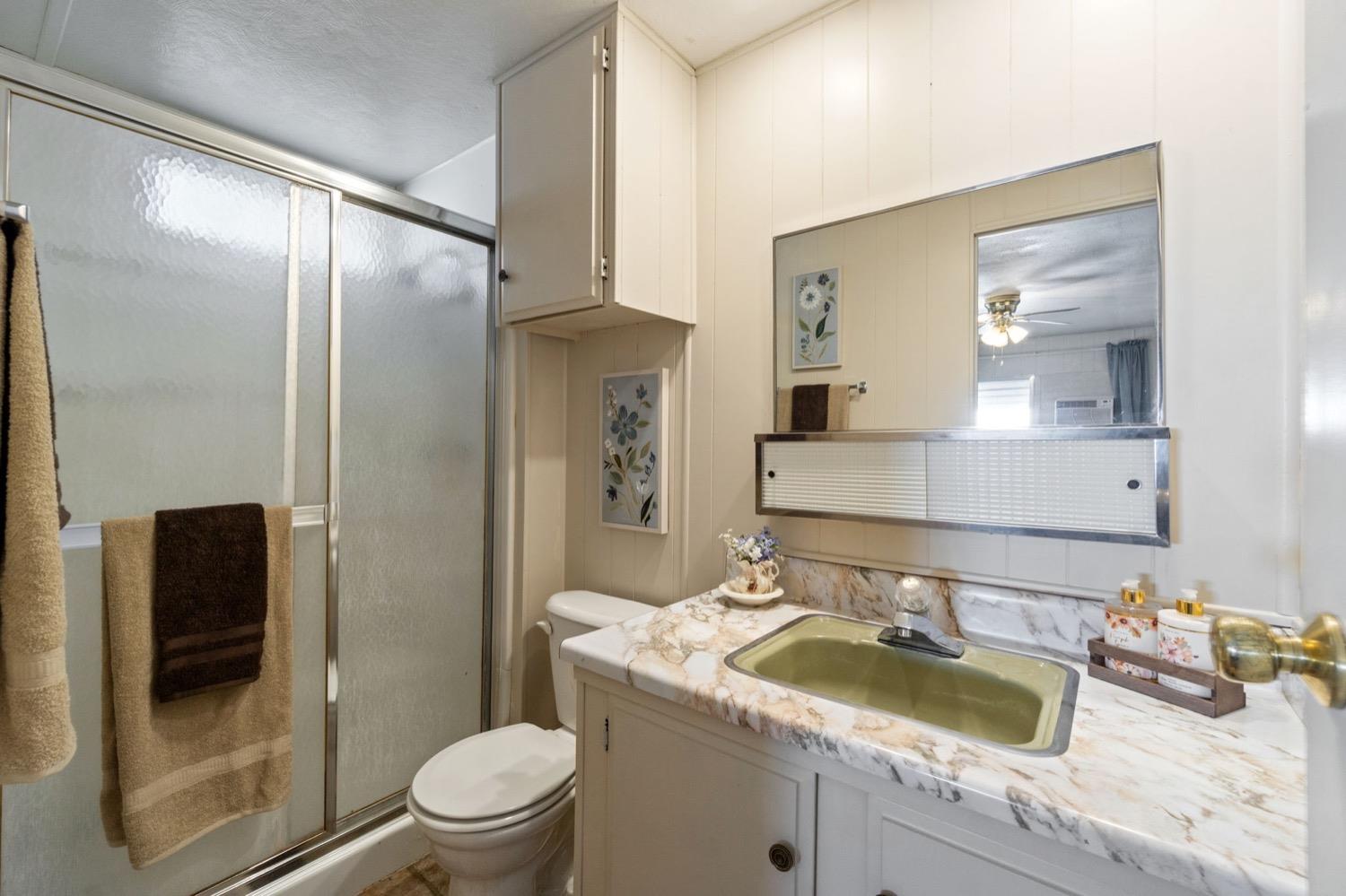 1500 Villa Avenue Clovis, CA 93612 - Photo 21 of 28 a bathroom with a sink a toilet and shower