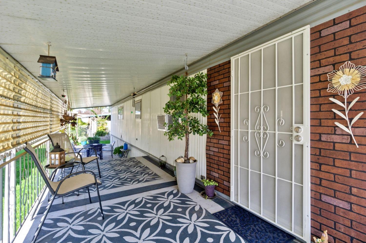 1500 Villa Avenue Clovis, CA 93612 - Photo 4 of 28 a backyard of a house with table and chairs