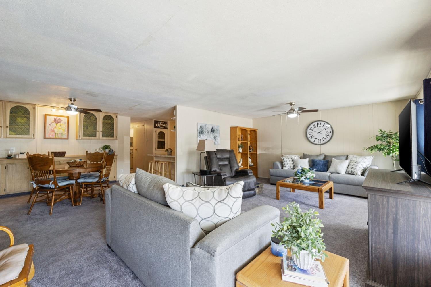 1500 Villa Avenue Clovis, CA 93612 - Photo 6 of 28 a living room with furniture kitchen view and a flat screen tv