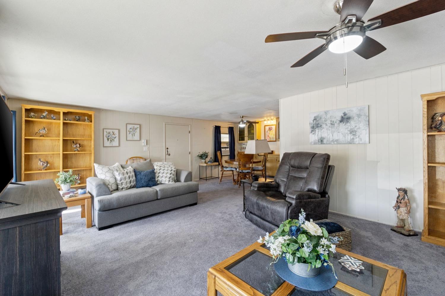 1500 Villa Avenue Clovis, CA 93612 - Photo 7 of 28 a living room with furniture chandelier and a window