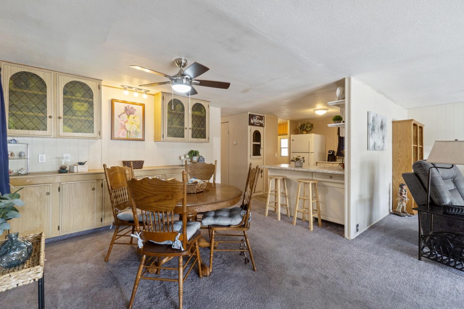 1500 Villa Avenue Clovis, CA 93612 - Photo 8 of 28 a view of a dining room with furniture and a chandelier