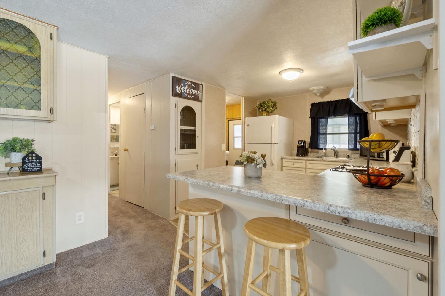 1500 Villa Avenue Clovis, CA 93612 - Photo 10 of 28 a bathroom with a granite countertop sink and a mirror