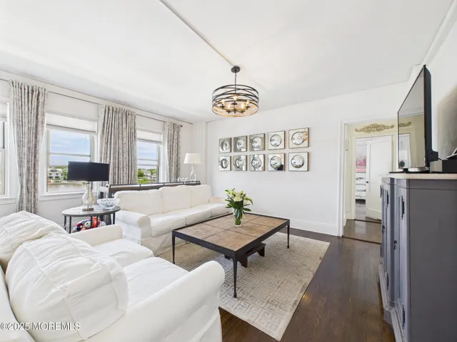 a living room with furniture and a table