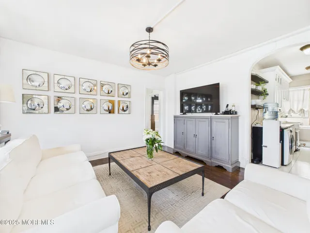 a living room with furniture and a table