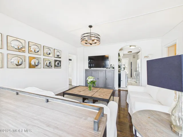 a living room with furniture and flat screen tv