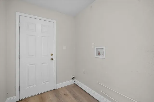 a view of small space with wooden floor