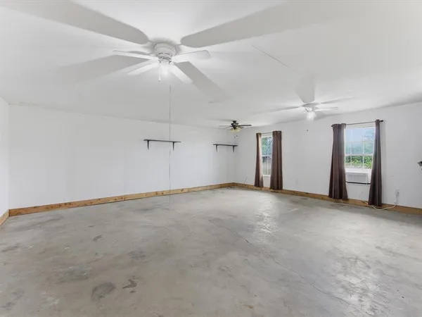 an empty room with a bathroom