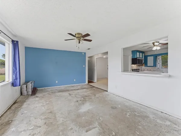 a kitchen with stainless steel appliances a stove microwave and cabinets