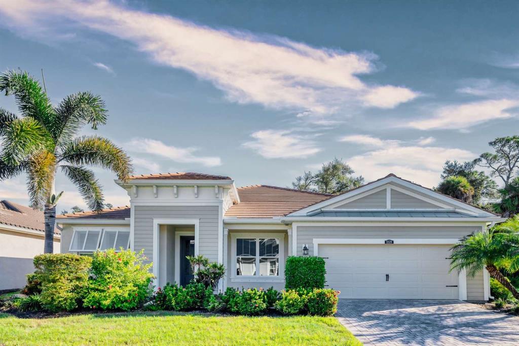 11539 Tapestry Lane Venice, FL 34293 - Photo 1 of 21 a view of house with garden and tall tress