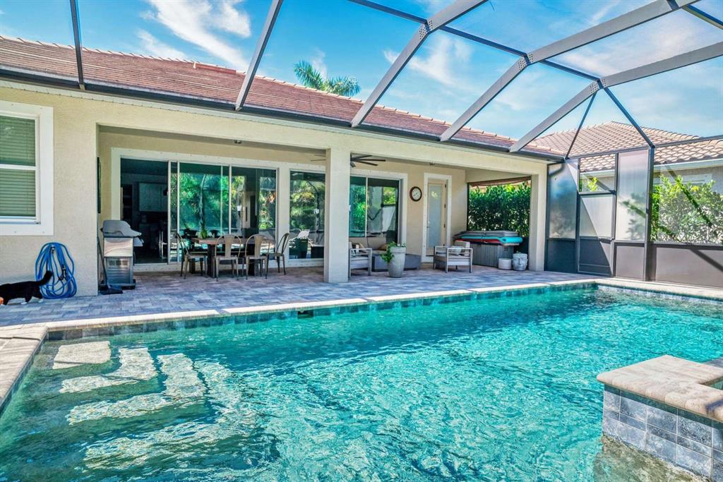 11539 Tapestry Lane Venice, FL 34293 - Photo 14 of 21 a view of a swimming pool with a patio