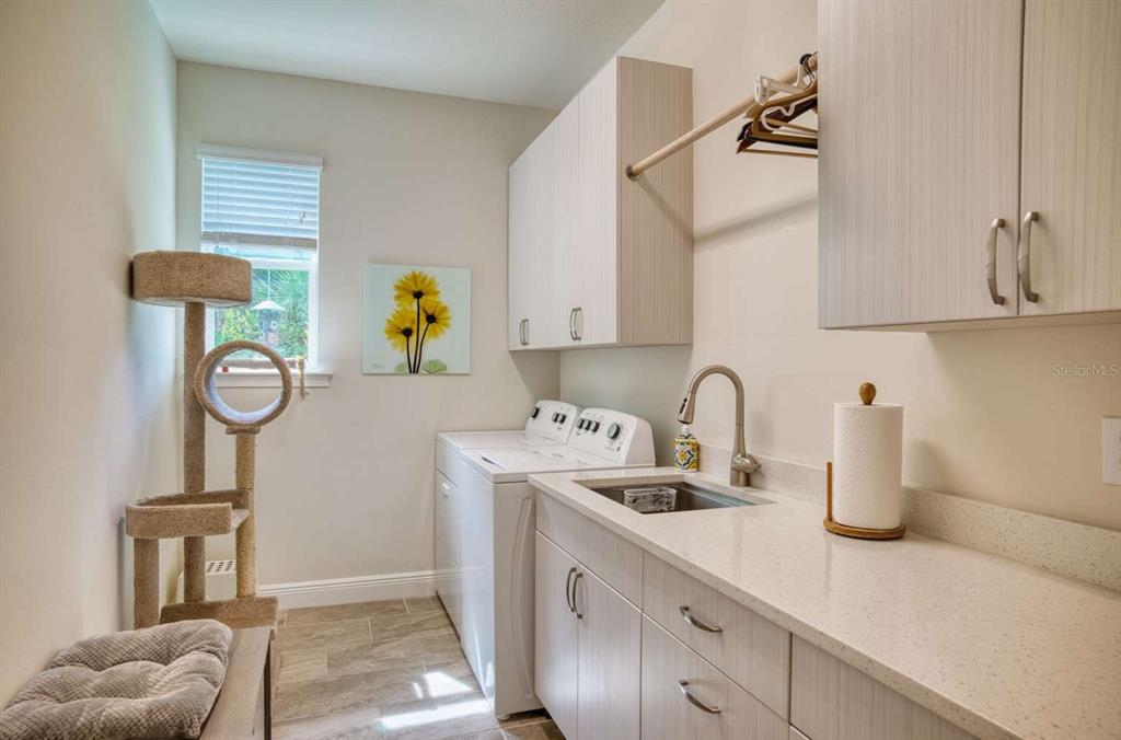 11539 Tapestry Lane Venice, FL 34293 - Photo 18 of 21 a kitchen with a sink cabinets and window
