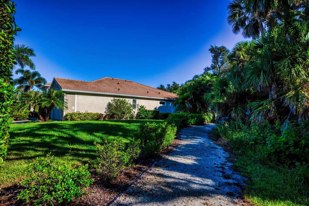 11539 Tapestry Lane Venice, FL 34293 - Photo 3 of 21 a view of a pathway with a house