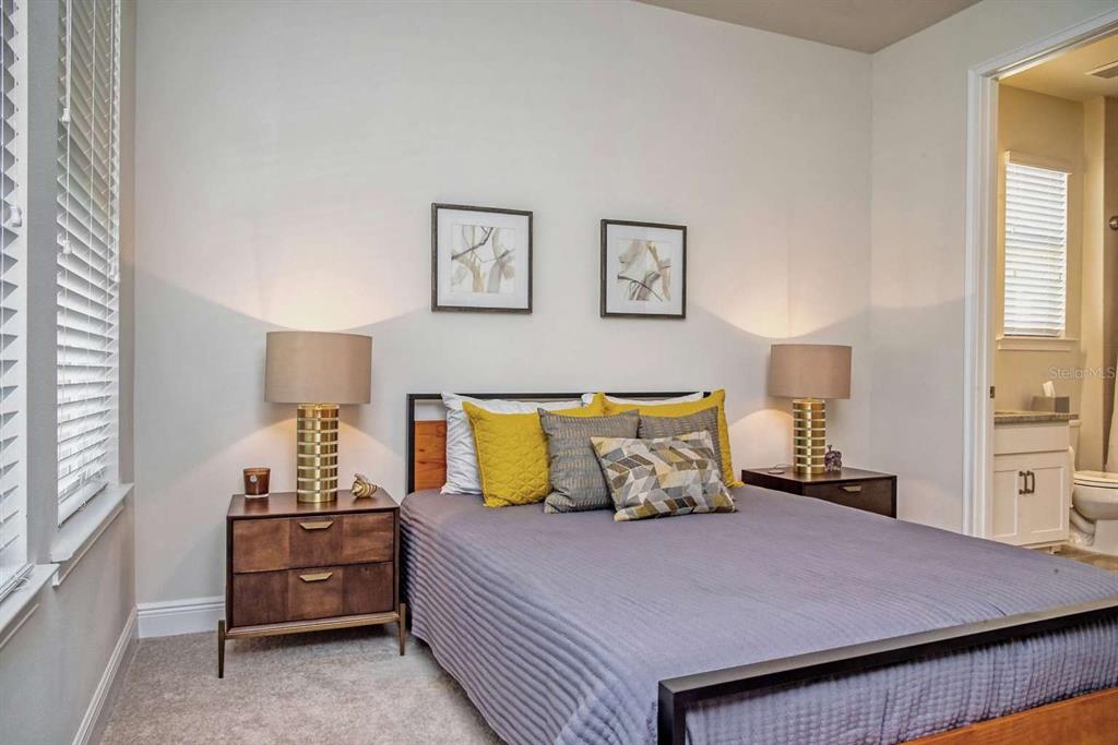 11539 Tapestry Lane Venice, FL 34293 - Photo 8 of 21 a bedroom with a bed and window