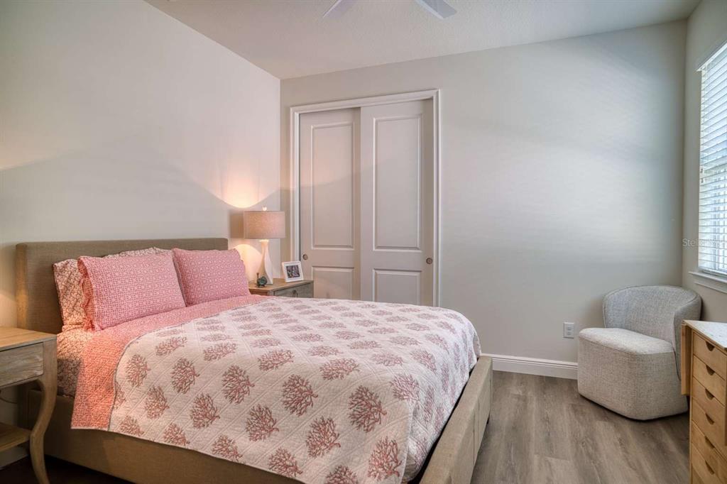 11539 Tapestry Lane Venice, FL 34293 - Photo 10 of 21 a bedroom with a bed and a couch