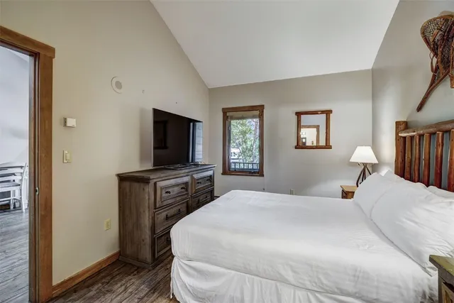 a bedroom with furniture and a window