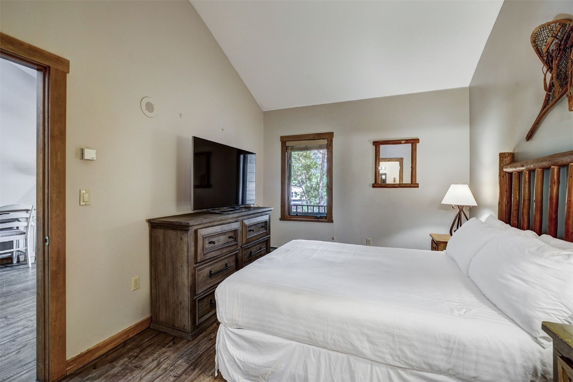 91 River Run Road, Unit 8134 Keystone, CO 80435 - Photo 17 of 30 a bedroom with a bed and a flat screen tv