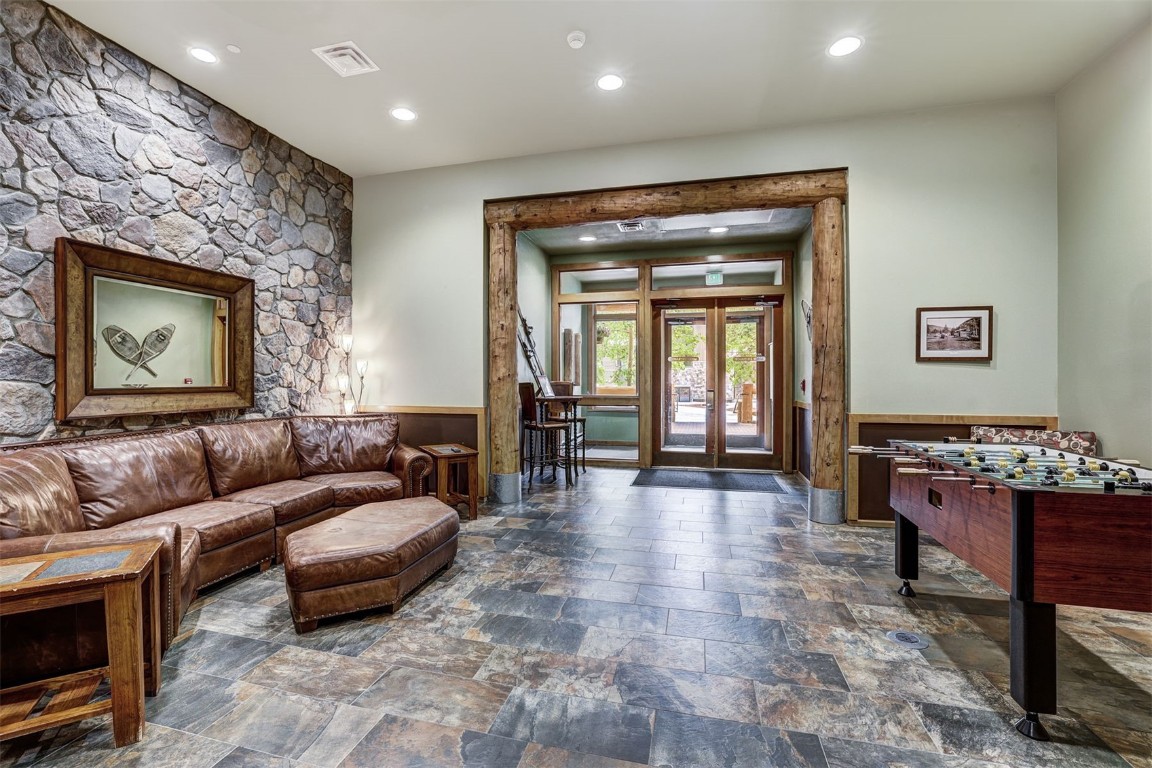 91 River Run Road, Unit 8134 Keystone, CO 80435 - Photo 20 of 30 a living room with furniture and a fireplace