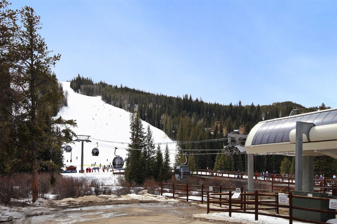 91 River Run Road, Unit 8134 Keystone, CO 80435 - Photo 28 of 30 a patio with table and chairs