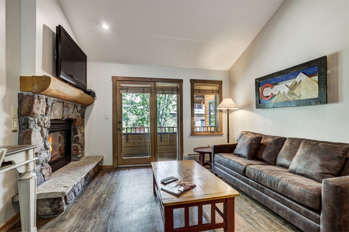 91 River Run Road, Unit 8134 Keystone, CO 80435 - Photo 6 of 30 a living room with furniture a flat screen tv and a fireplace