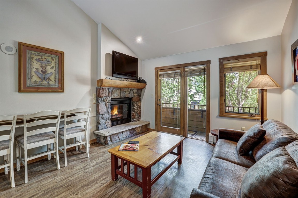 91 River Run Road, Unit 8134 Keystone, CO 80435 - Photo 7 of 30 a living room with furniture a flat screen tv and a fireplace