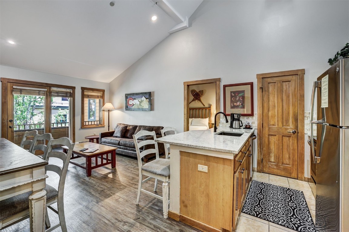 91 River Run Road, Unit 8134 Keystone, CO 80435 - Photo 10 of 30 a view of a kitchen filled with furniture and wooden floor