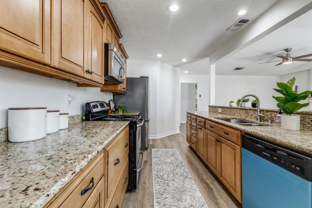 2020 Meadowbrook Drive Mesquite, TX 75149 - Photo 13 of 31 Granite countertops and updated cabinetry.