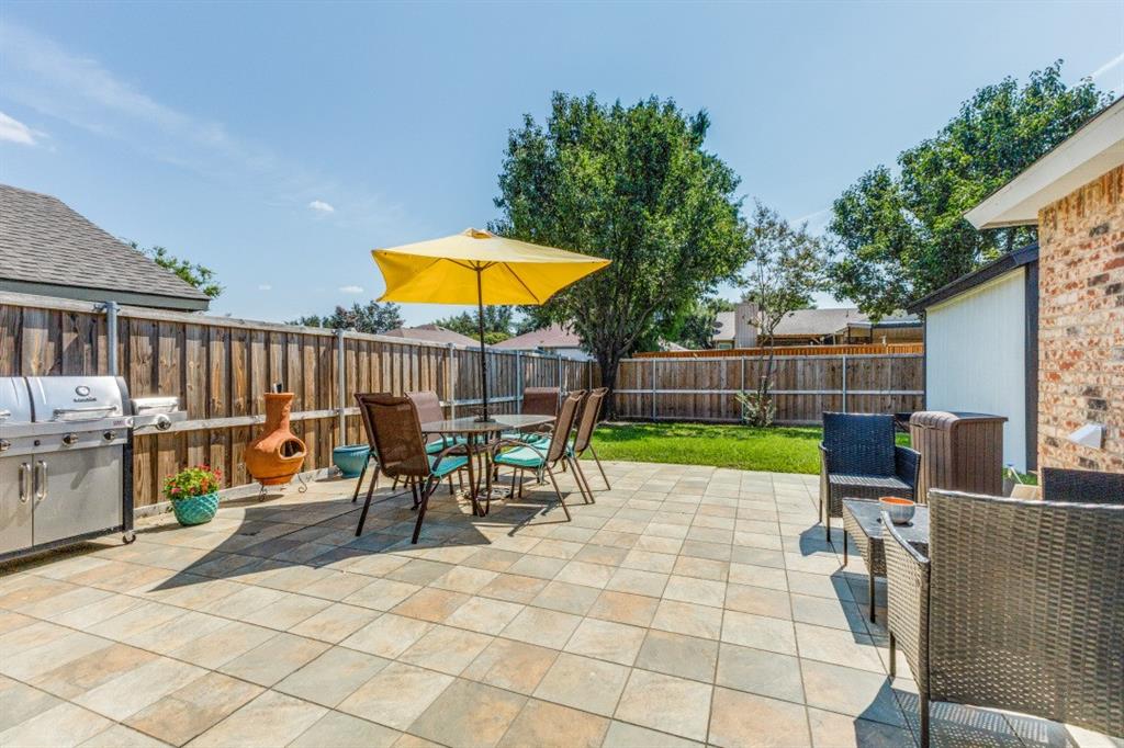 2020 Meadowbrook Drive Mesquite, TX 75149 - Photo 27 of 31 Fenced backyard with outdoor dining space and a patio.