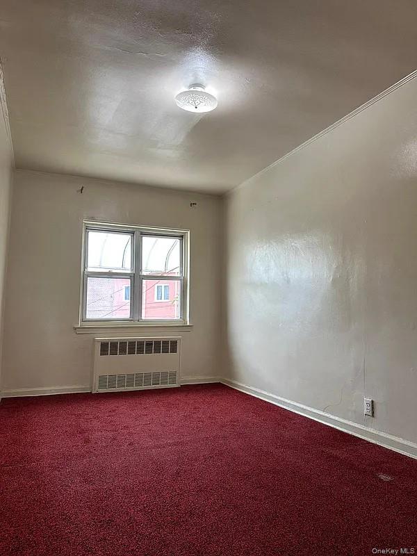 47-05 Newtown Road Queens, NY 11103 - Photo 17 of 21 an empty room with a window