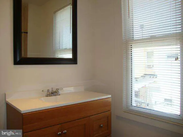 a bathroom with a sink and a vanity