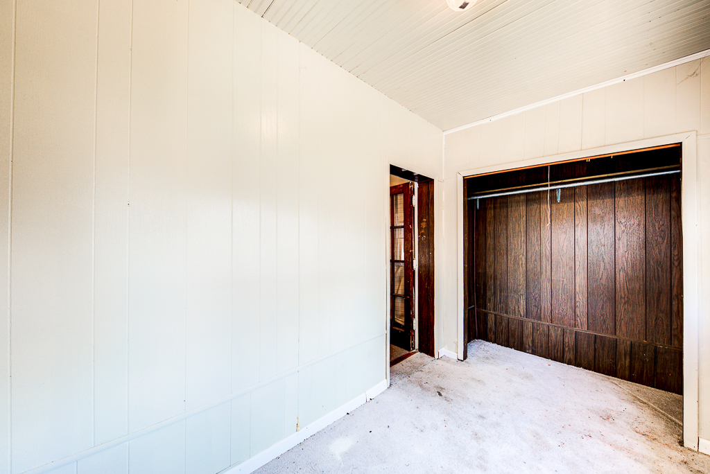 8024 South Perry Avenue Chicago, IL 60620 - Photo 12 of 37 an empty room with wooden floor