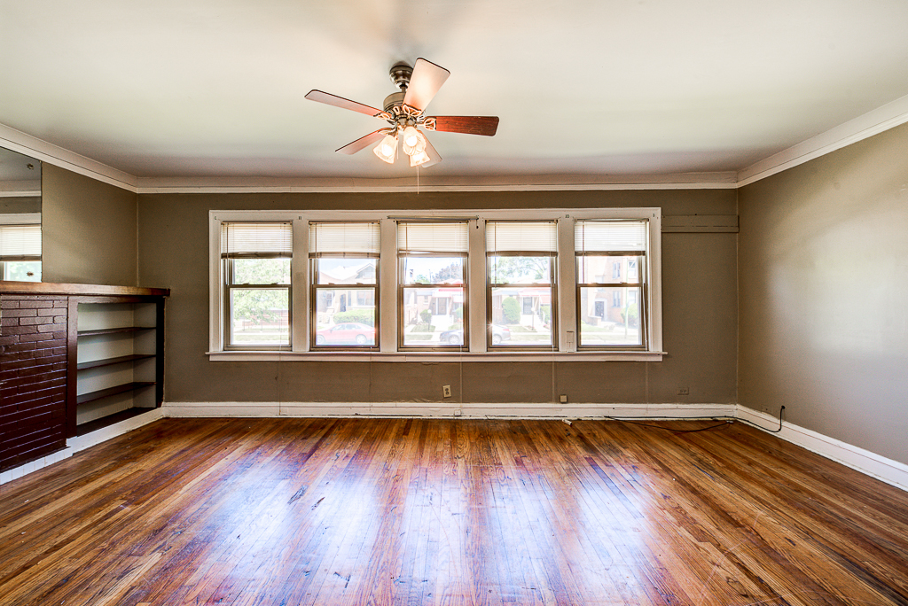 8024 South Perry Avenue Chicago, IL 60620 - Photo 16 of 37 wooden floor in an empty room with a window
