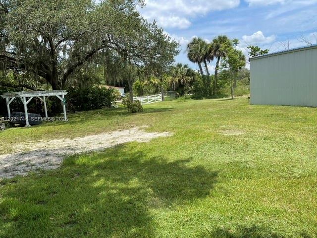1326 Red Barn Rd N West Moore Haven, FL 33471 - Photo 4 of 13 a view of a trees in a yard