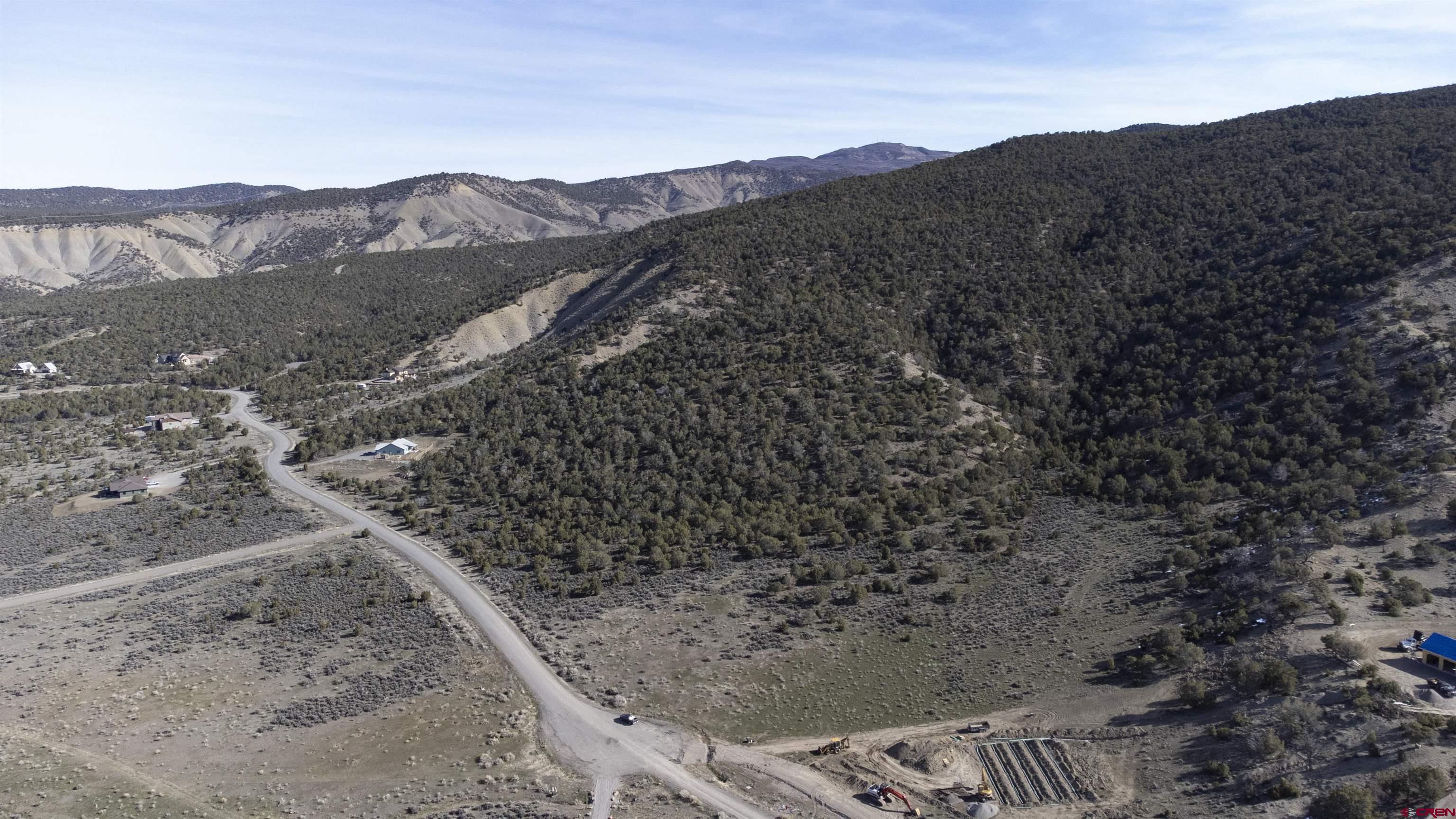 Tbd Tbd Road Montrose, CO 81403 - Photo 7 of 11 a view of a dry yard with mountains in the background