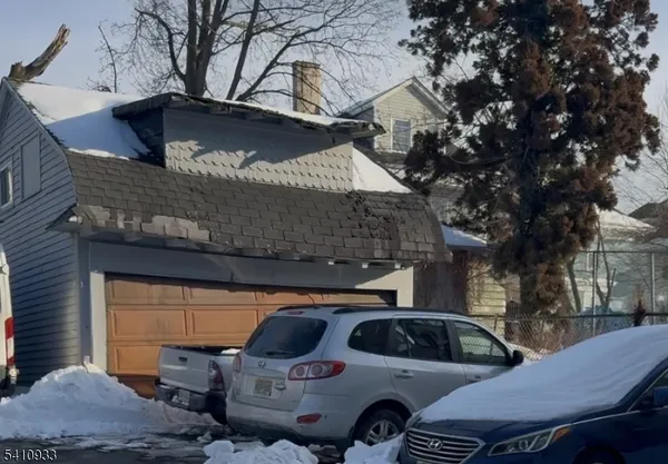 a kitchen with a stove a sink and a refrigerator